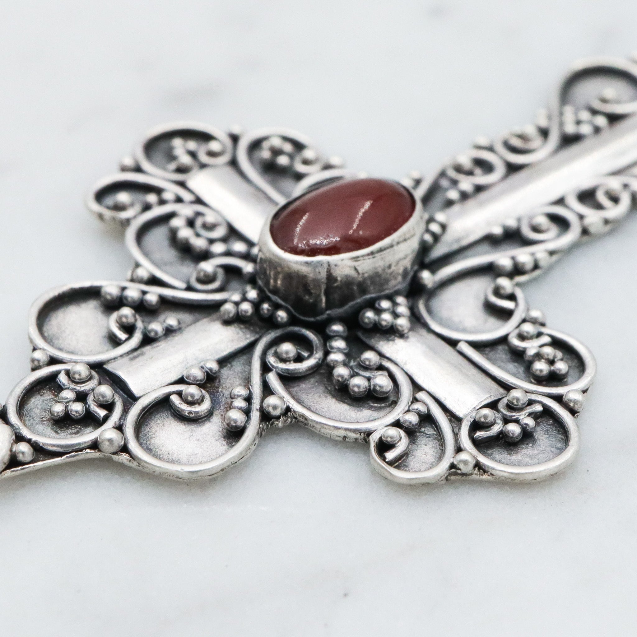 Vintage sterling silver & carnelian fancy scroll cross pendant